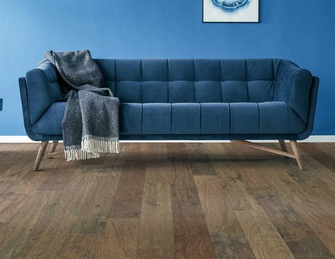 Blue sofa on Hardwood flooring | Carpet House Flooring Center